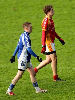 Tommy O'Reilly (in the blue of Breaffy) and Eoghan O'Reilly (in the red of Castlebar Mitchels).