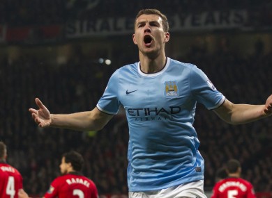 Manchester City's Edin Dzeko celebrates after scoring his second goal against Manchester United.